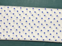 Cotton 100% Patterned - small navy blue hearts on white back
