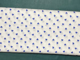 Cotton 100% Patterned - small navy blue hearts on white back