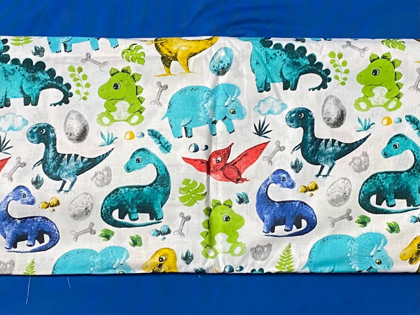 Cotton 100% Kids - turquoise-yellow dinosaurs with pterodactyl on a white back