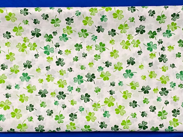 Cotton 100% Patterned - green clover flowers on white back