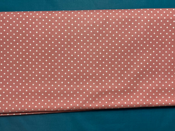 Cotton 100% Patterned - White polka dots on a dark coral background