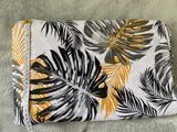 Cotton 100% Patterned - yellow monstera leaves black on white